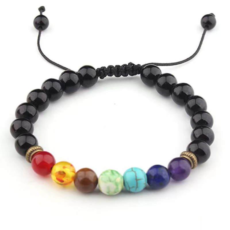 Glossy black onyx beads with seven chakra stones and bronze spacers