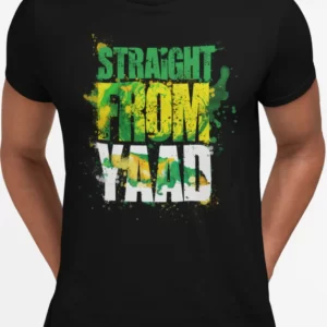 A black crewneck Jamaican T-shirt with a vibrant graphic print that reads 'STRAIGHT FROM YAAD' in a large, distressed typeface with splatters of green, yellow, and black paint around the words, reflecting the Jamaican flag colors. This T-shirt is featured on the Jamaican clothing online store, DiGoodTingsDem.com