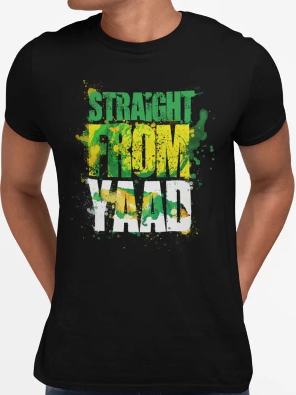 A black crewneck Jamaican T-shirt with a vibrant graphic print that reads 'STRAIGHT FROM YAAD' in a large, distressed typeface with splatters of green, yellow, and black paint around the words, reflecting the Jamaican flag colors. This T-shirt is featured on the Jamaican clothing online store, DiGoodTingsDem.com